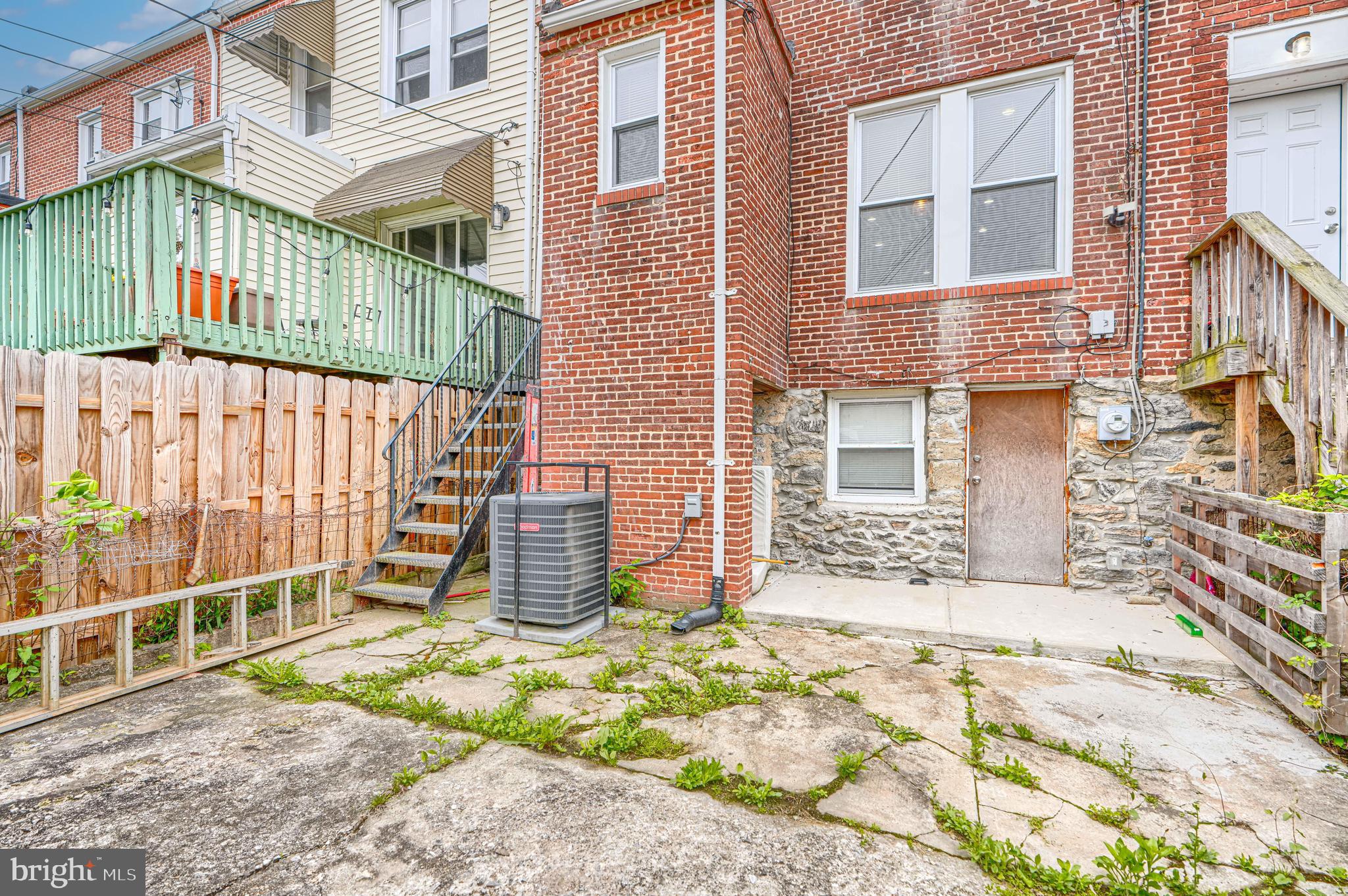 1702 East 32nd Street Baltimore, MD 21218 - Photo 38 of 38 a backyard of a house with barbeque oven and table