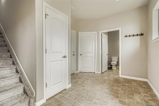 a view of a hallway with a room