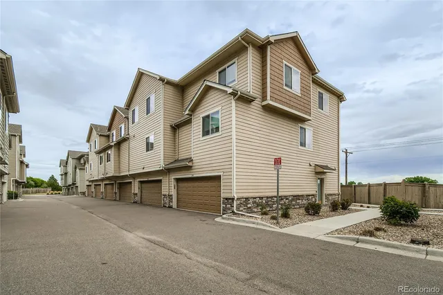 a view of a swimming pool with a yard