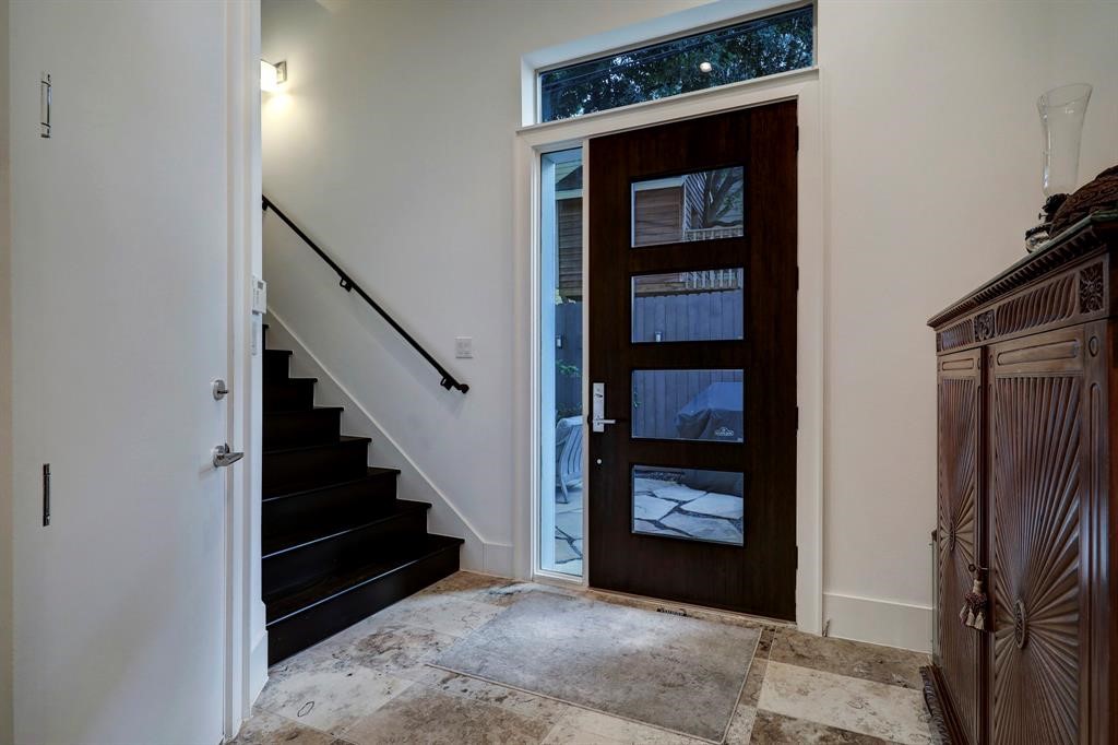 2007 Brun Street, Unit D Houston, TX 77019 - Photo 2 of 25 Inviting entryway welcomes you with high ceilings, neutral tones and modern tile flooring