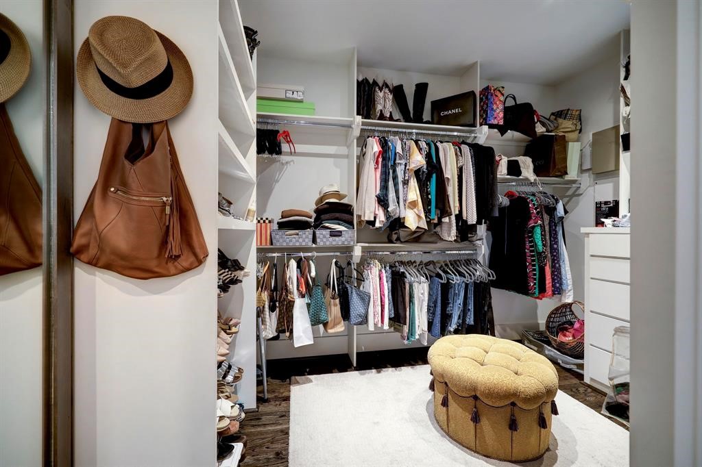 2007 Brun Street, Unit D Houston, TX 77019 - Photo 23 of 25 Expansive custom walk-in closet with built-in shelving and ample hanging space