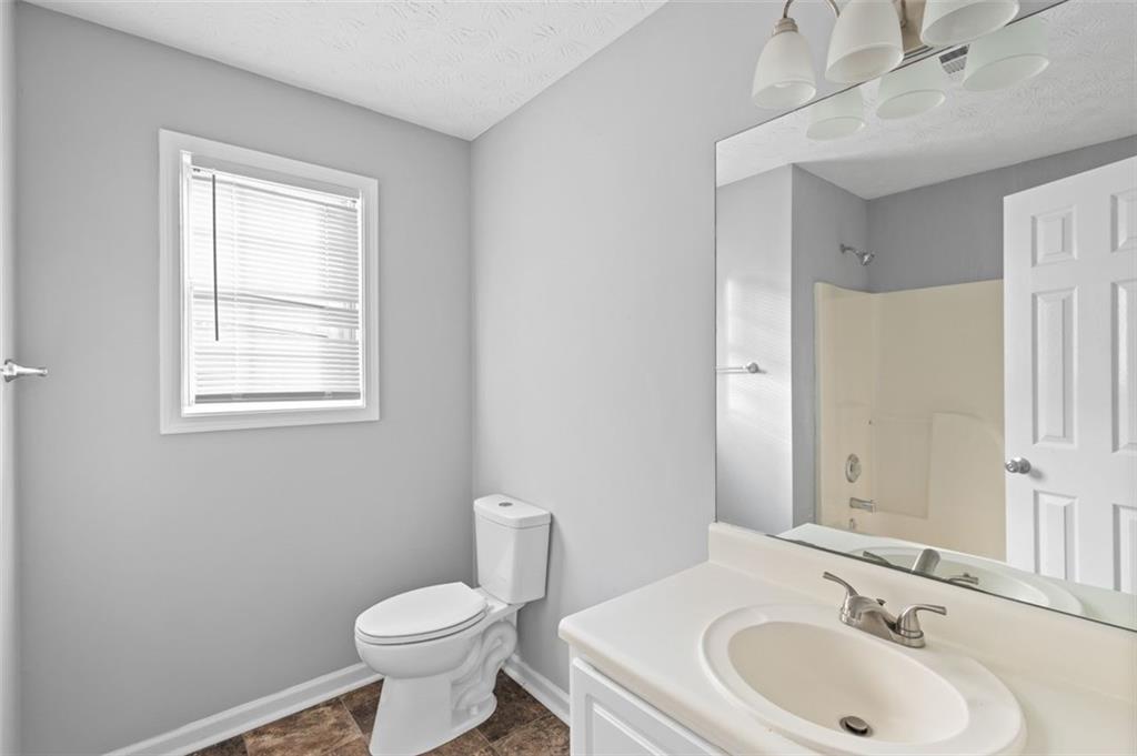 418 Ellerbe Drive Statham, GA 30666 - Photo 18 of 24 a bathroom with a toilet sink and mirror