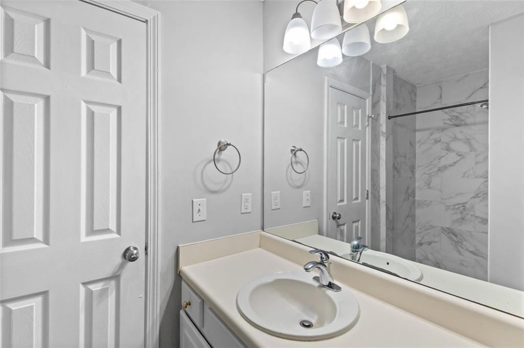 418 Ellerbe Drive Statham, GA 30666 - Photo 21 of 24 a bathroom with a sink a toilet and shower