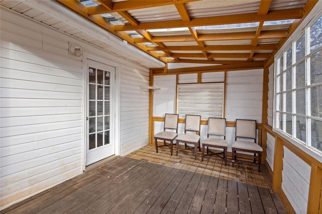 418 Ellerbe Drive Statham, GA 30666 - Photo 23 of 24 a view of a patio with table and chairs with wooden floor