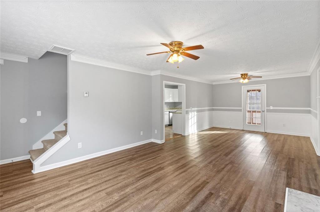 418 Ellerbe Drive Statham, GA 30666 - Photo 4 of 24 wooden floor in an empty room with a window