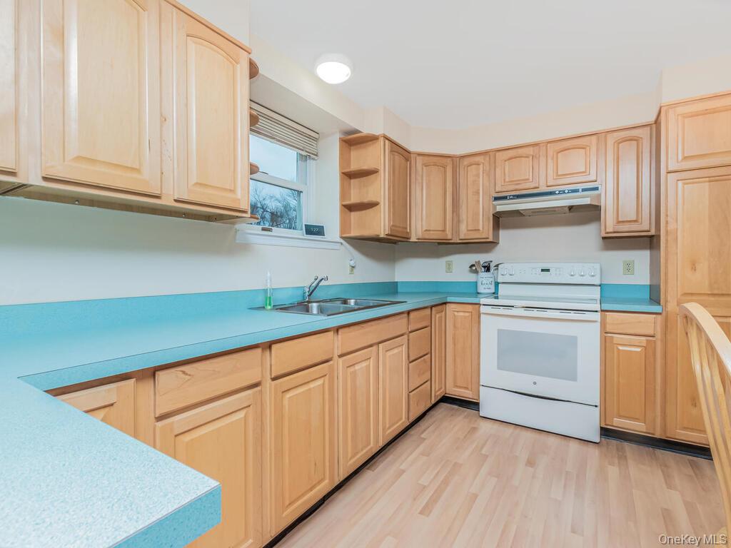 70 Breckenridge Road Mahopac, NY 10541 - Photo 18 of 29 Kitchen with electric stove, light brown cabinetry, and open shelves