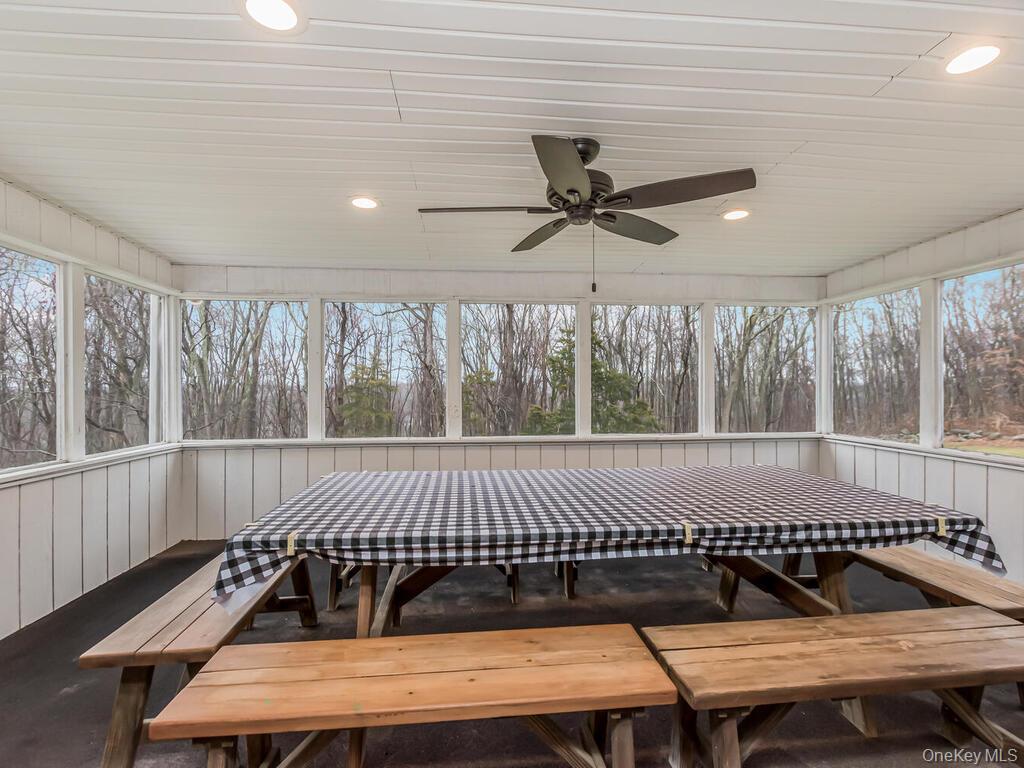 70 Breckenridge Road Mahopac, NY 10541 - Photo 9 of 29 Unfurnished sunroom featuring recessed lighting and wood walls