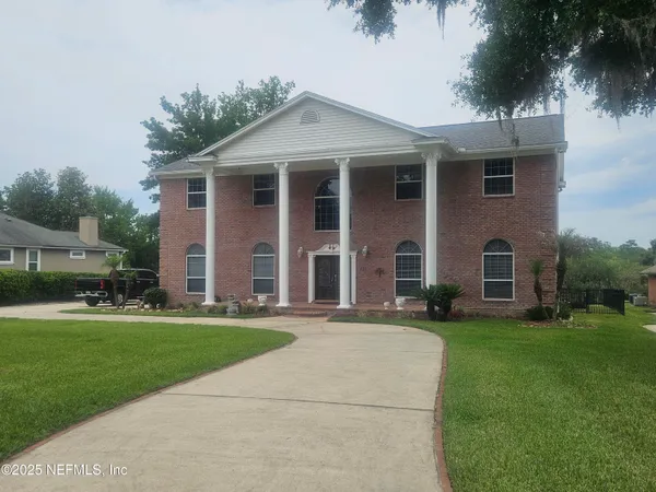 a view of a swimming pool with a porch