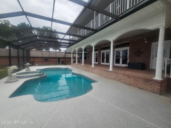 a view of a swimming pool with seating area