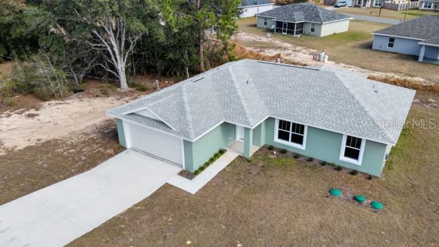 25 Locust Loop Lane Ocala, FL 34472 - Photo 1 of 35 a aerial view of a house with a yard