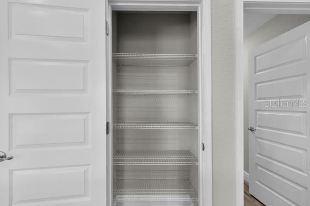 25 Locust Loop Lane Ocala, FL 34472 - Photo 12 of 35 a view of walk in closet with empty racks