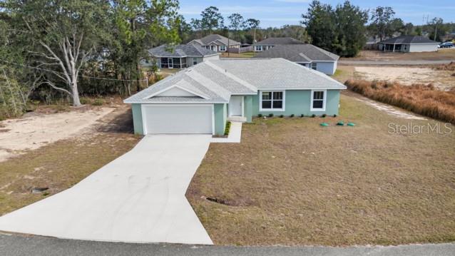 25 Locust Loop Lane Ocala, FL 34472 - Photo 23 of 35 a house with a outdoor space