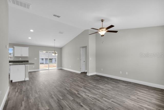 25 Locust Loop Lane Ocala, FL 34472 - Photo 4 of 35 a view of an empty room with a kitchen
