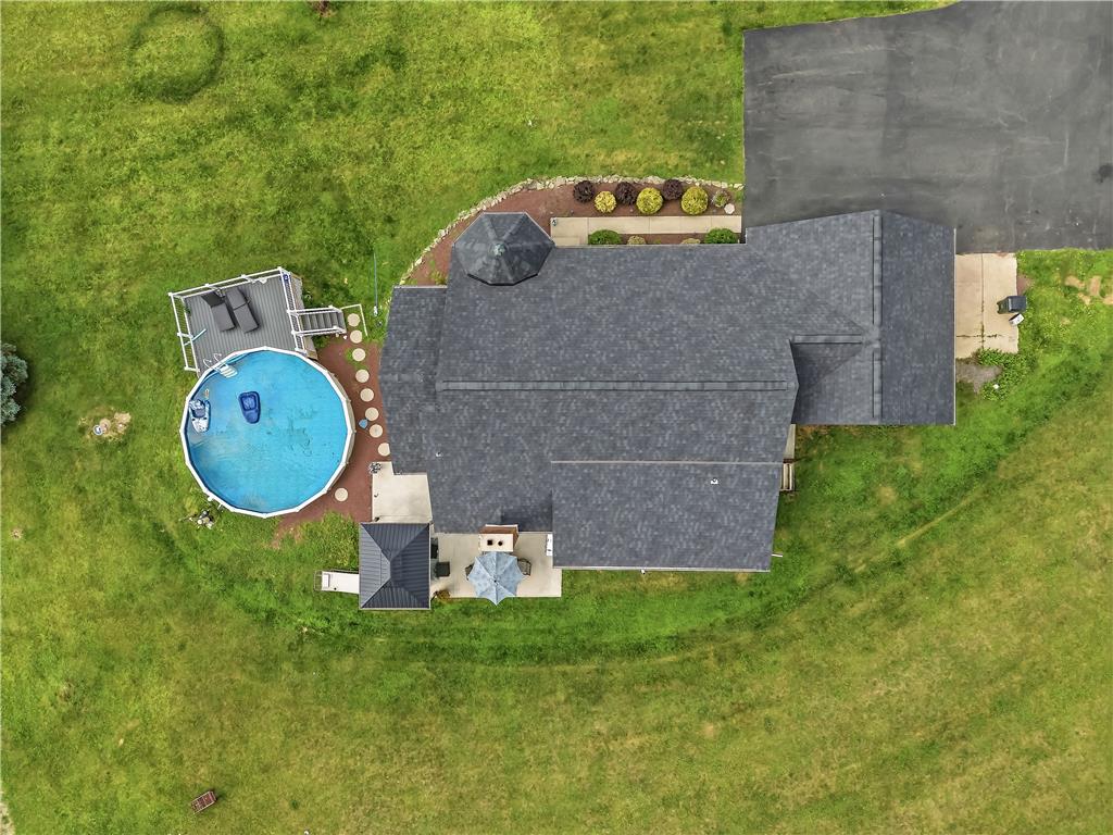 9868 Stagecoach Road Kempton, PA 19529 - Photo 14 of 17 An aerial perspective reveals a well-maintained roof, a refreshing pool, and ample green space.