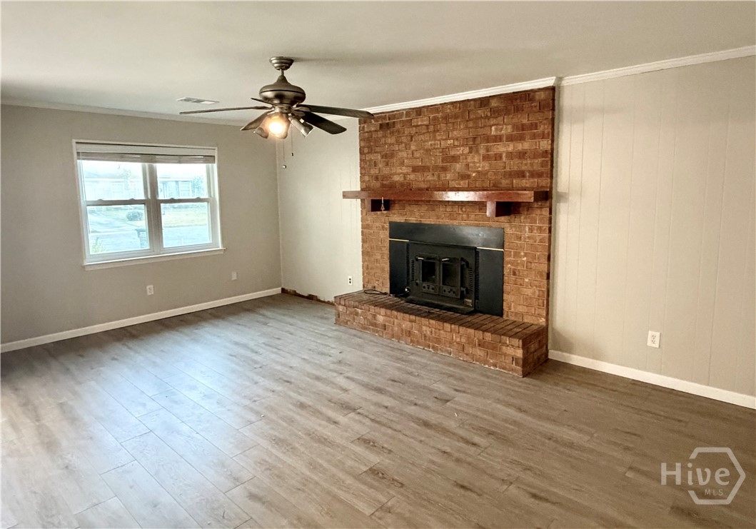 302 Burlington Road Savannah, GA 31410 - Photo 5 of 30 Greatroom with wood-burning stove.