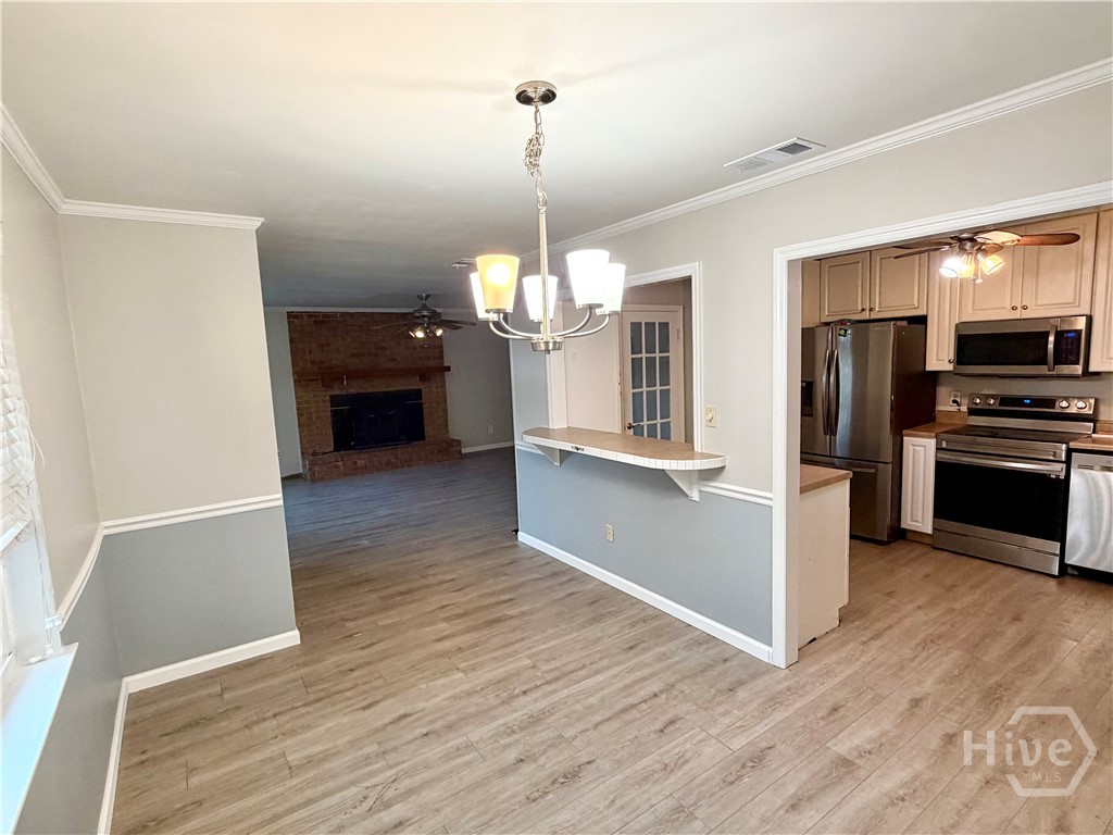 302 Burlington Road Savannah, GA 31410 - Photo 8 of 30 Dining area open to the Greatroom and equipped kitchen