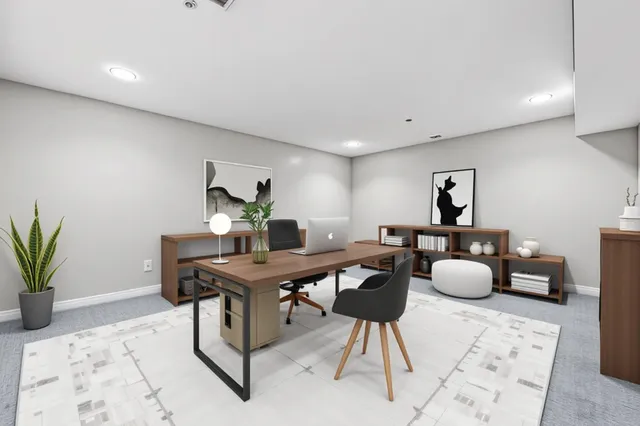 a view of a workspace with furniture