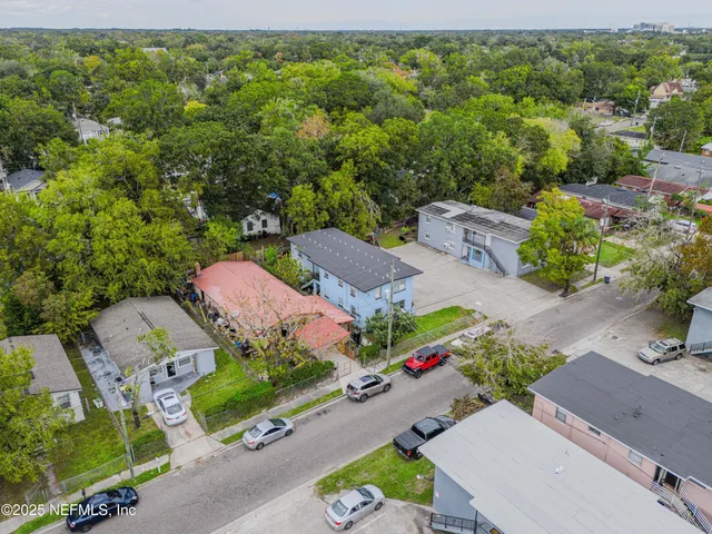 an aerial view of a houses with outdoor space