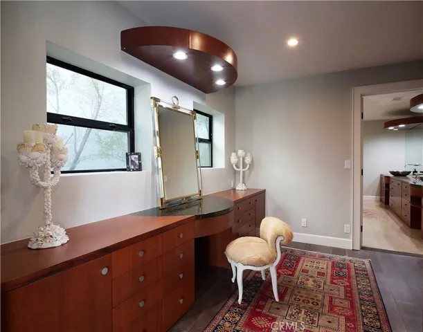 a large kitchen with kitchen island a sink stainless steel appliances and cabinets