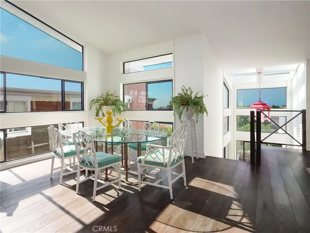 a living room with furniture a rug and a table