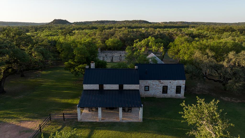 268 Marschall Creek Road Fredericksburg, TX 78624 - Photo 1 of 77 a view of a house with a yard