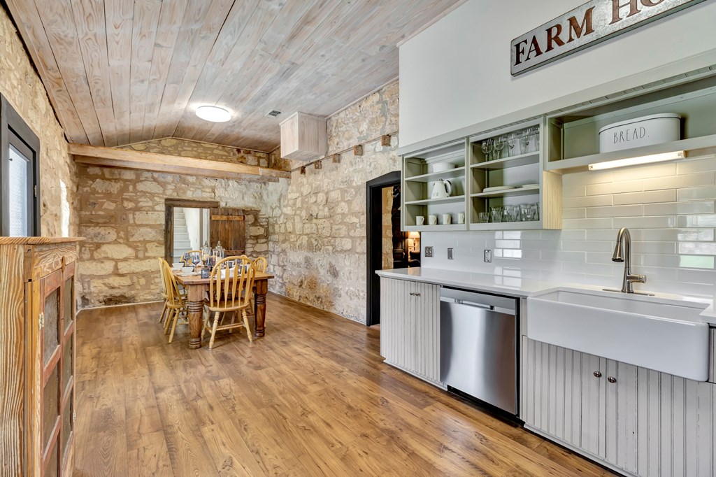 268 Marschall Creek Road Fredericksburg, TX 78624 - Photo 15 of 77 a kitchen with stainless steel appliances granite countertop a sink and cabinets