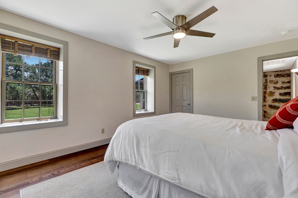 268 Marschall Creek Road Fredericksburg, TX 78624 - Photo 20 of 77 a bedroom with a bed and window