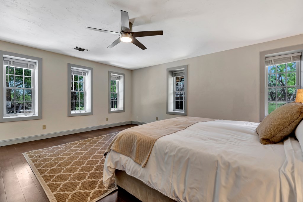 268 Marschall Creek Road Fredericksburg, TX 78624 - Photo 25 of 77 a bedroom with a bed and a window