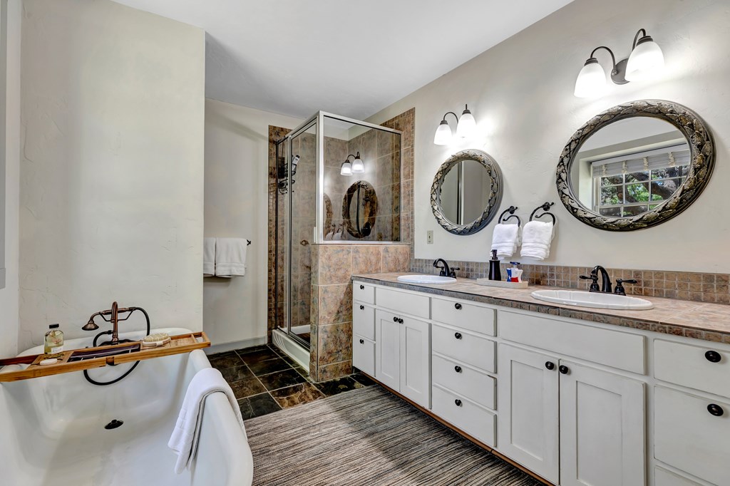 268 Marschall Creek Road Fredericksburg, TX 78624 - Photo 28 of 77 a bathroom with a double vanity sink and a mirror