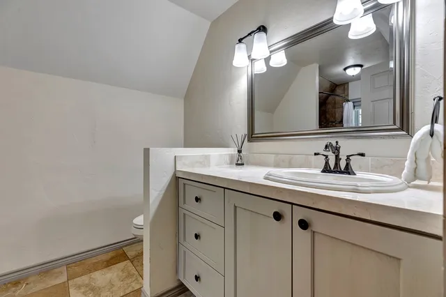a view of a patio with a table chairs and a backyard