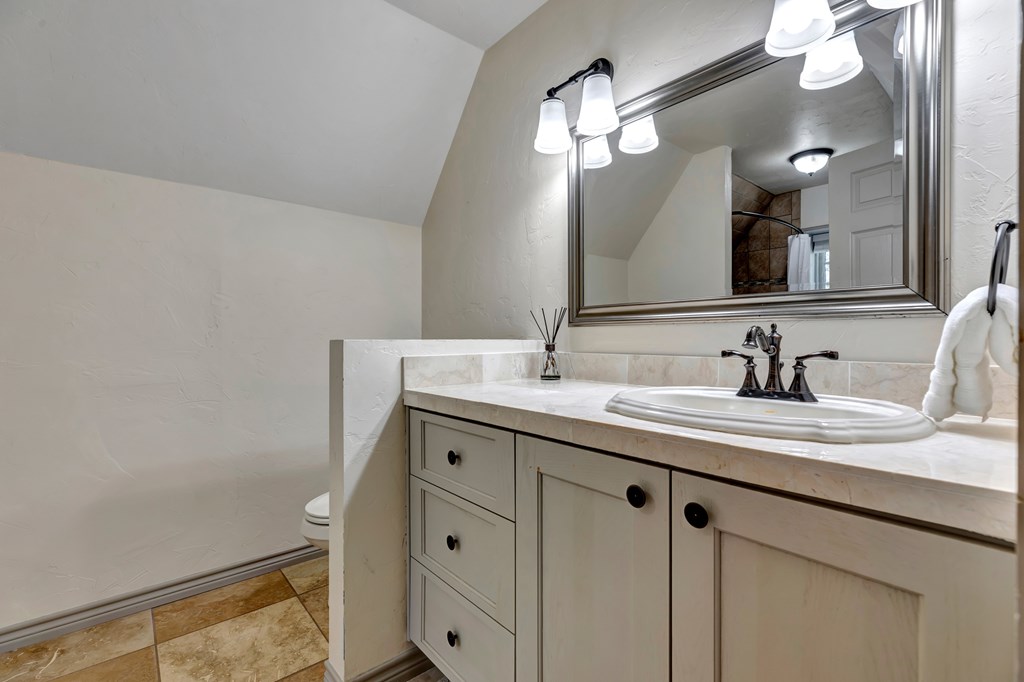 268 Marschall Creek Road Fredericksburg, TX 78624 - Photo 34 of 77 a bathroom with a sink and a mirror