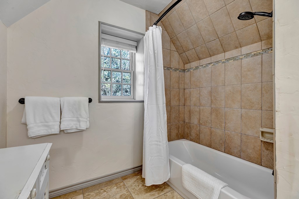 268 Marschall Creek Road Fredericksburg, TX 78624 - Photo 35 of 77 a bathroom with a bathtub and shower