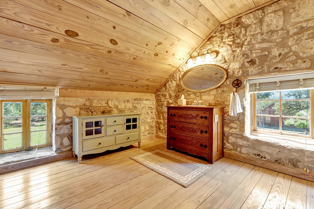 268 Marschall Creek Road Fredericksburg, TX 78624 - Photo 43 of 77 a view of a hallway with a dresser and a window
