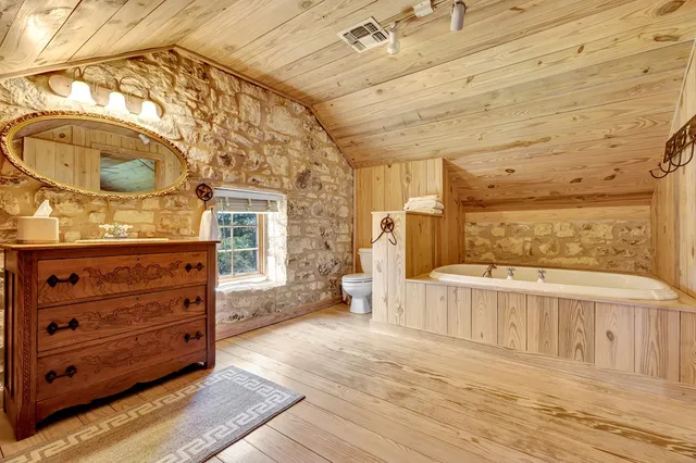 a backyard of a house with lots of green space table and chairs