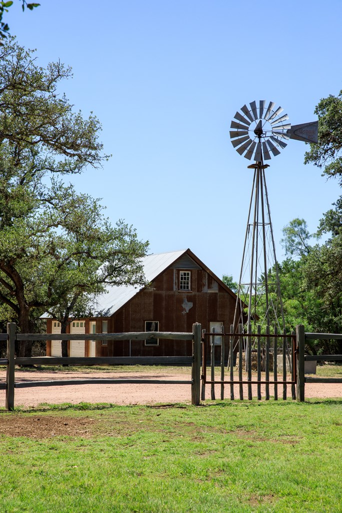 268 Marschall Creek Road Fredericksburg, TX 78624 - Photo 45 of 77 a front view of a house with a garden