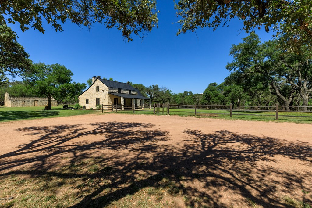268 Marschall Creek Road Fredericksburg, TX 78624 - Photo 55 of 77 a view of yard with green space and trees in the background