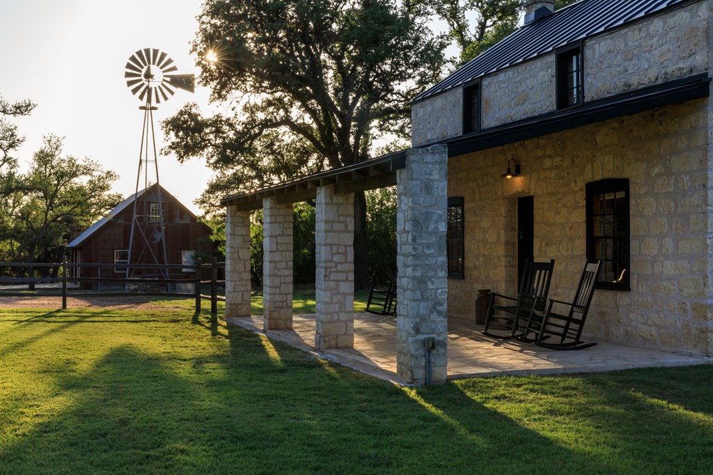 268 Marschall Creek Road Fredericksburg, TX 78624 - Photo 57 of 77 a view of a house with backyard and sitting area