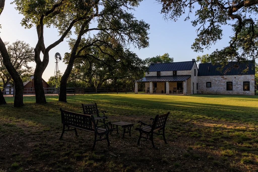 268 Marschall Creek Road Fredericksburg, TX 78624 - Photo 58 of 77 a swimming pool with outdoor seating and yard