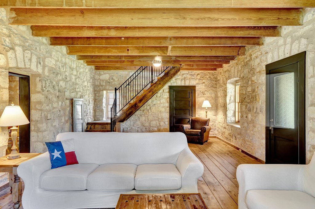 268 Marschall Creek Road Fredericksburg, TX 78624 - Photo 7 of 77 a living room with furniture and a chandelier