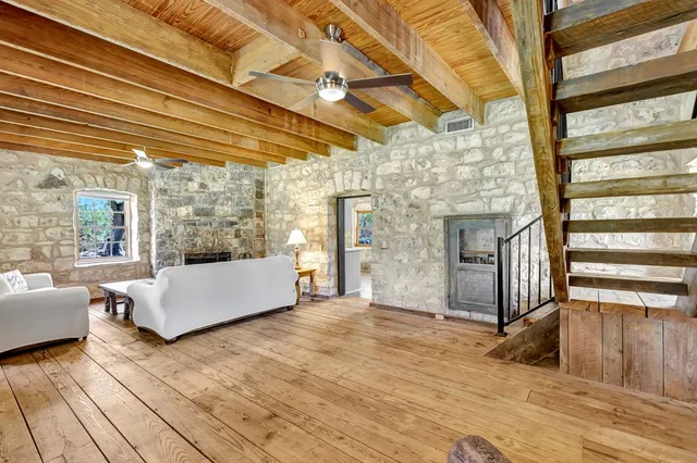 a kitchen with stainless steel appliances granite countertop a sink and cabinets