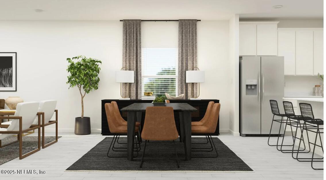 460 Hasler Avenue St. Augustine, FL 32092 - Photo 23 of 37 a view of a dining room with furniture and a potted plant