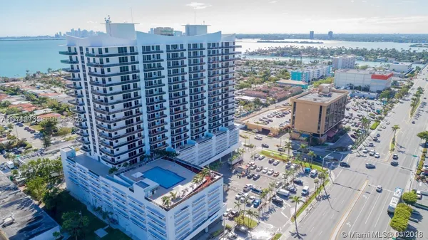 a view of a swimming pool with outdoor seating