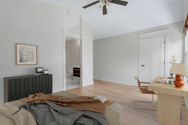 a bedroom with a bed and a dresser