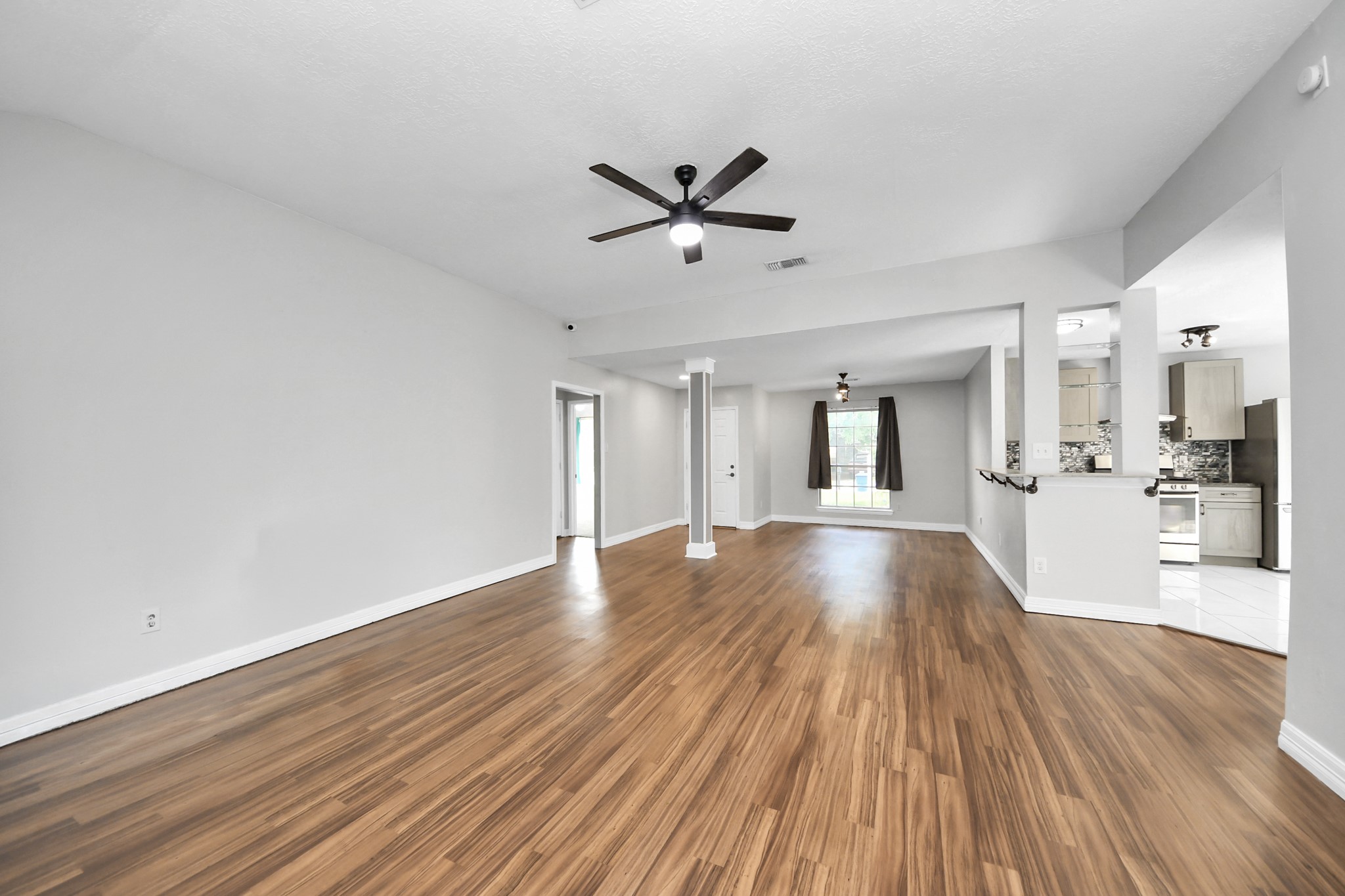 28707 Stapleford Street Spring, TX 77386 - Photo 9 of 38 a view of an empty room and wooden floor