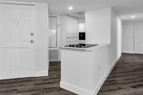 a kitchen with a stove and a refrigerator