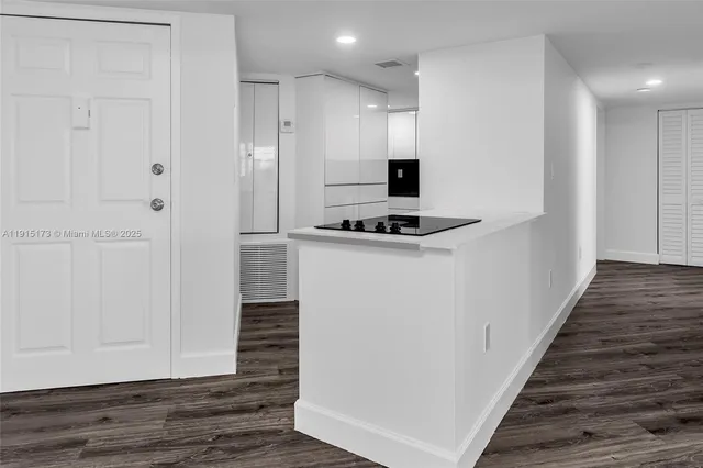 a kitchen with a stove and a refrigerator