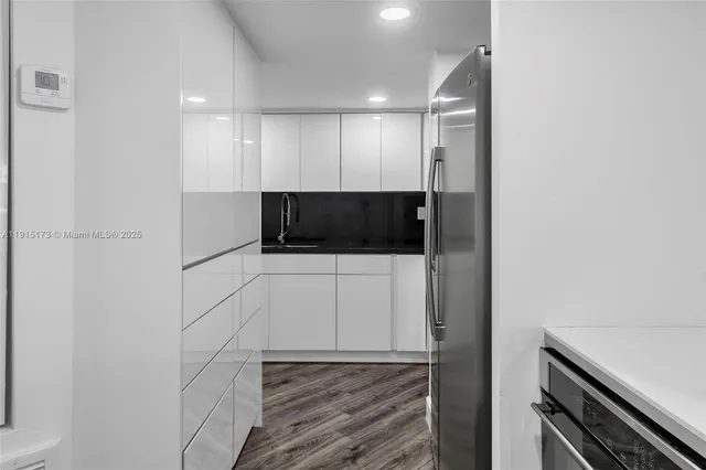 a view of hallway with washer and dryer