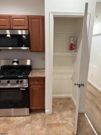 a kitchen with a stove and a cabinet