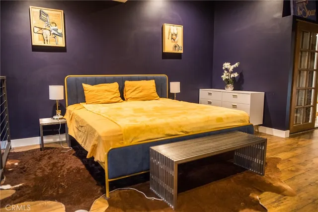 a bedroom with a bed and dresser