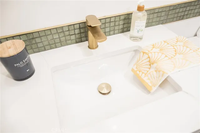 a bathroom with a shower and a sink